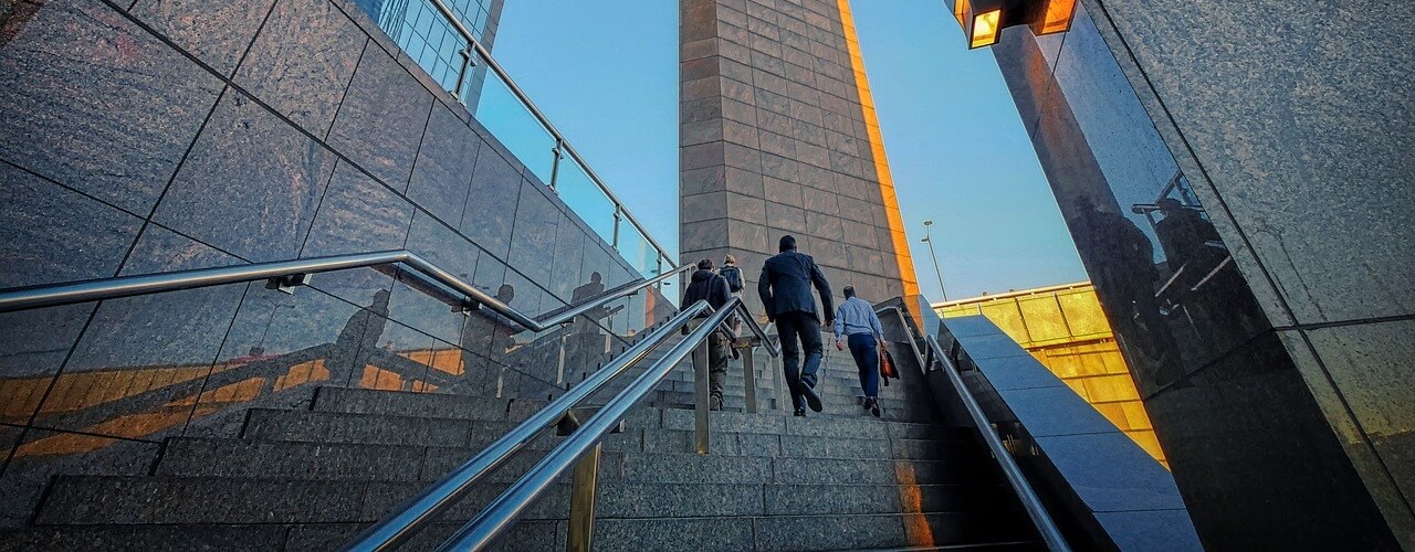 modern building image used as a banner for a telecommunication and media facility management service page